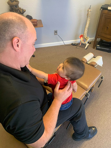 Chiropractor Flower Mound TX Tory Schoonmaker Adjusting Infant